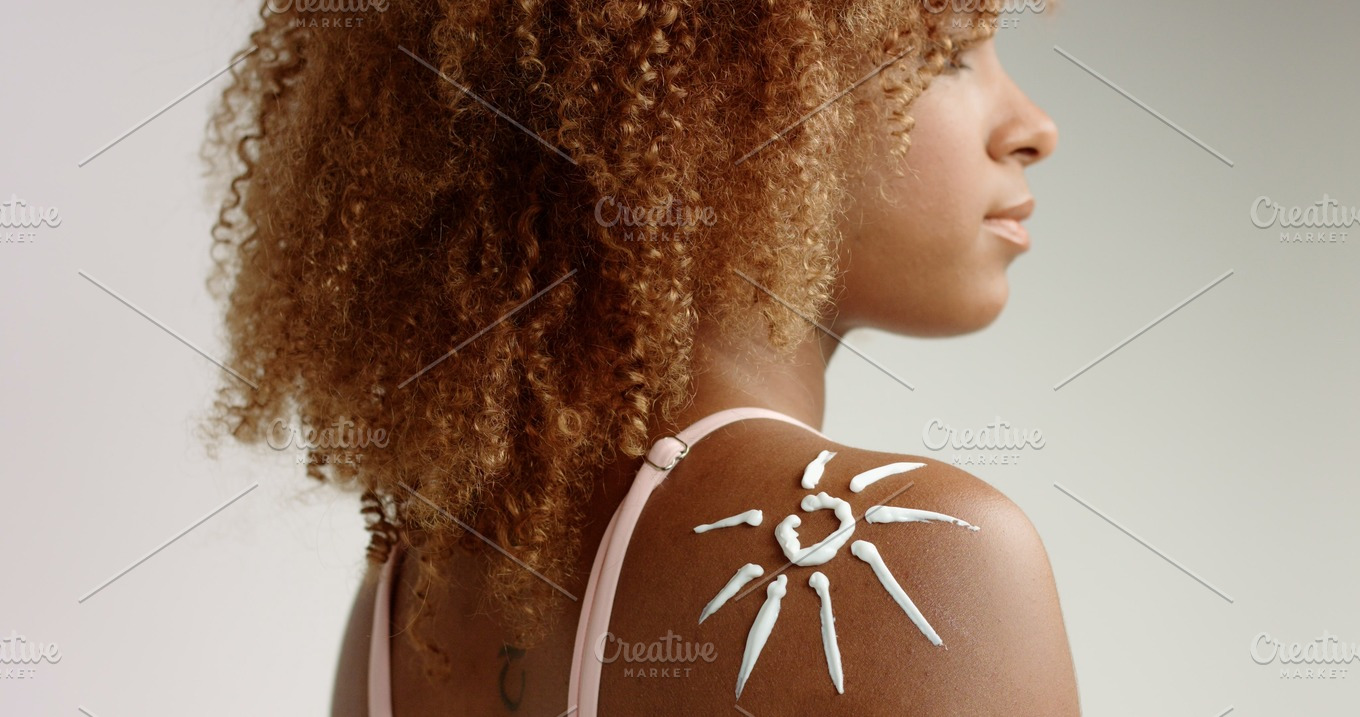 mixed race black woman with blonde curly hair in studio ...