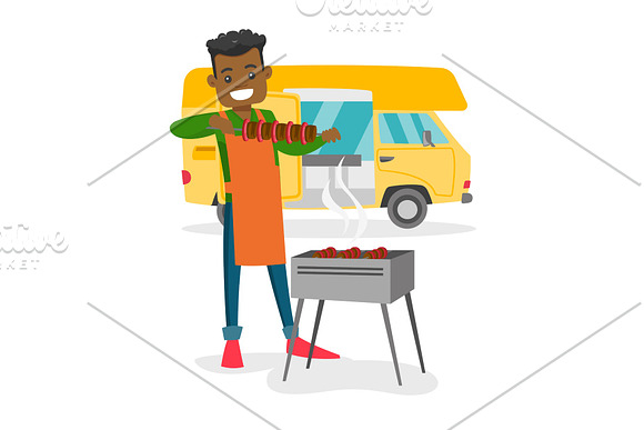 Young Man Barbecuing Meat In Front Of Camper Van