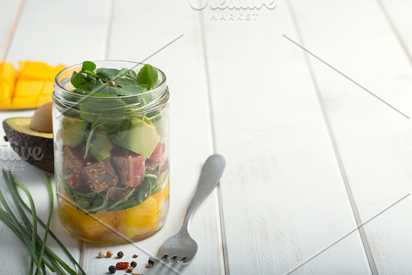 Hawaiian Poke Salad With Tuna Avocado Mango And Vegetables On A White Wooden Rustic Background