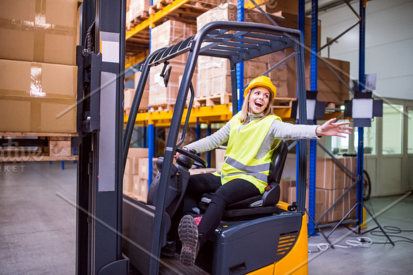 Woman Warehouse Worker With Forklift
