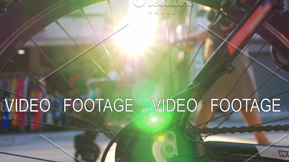View Through Bike Wheel To Street And Sun Flare
